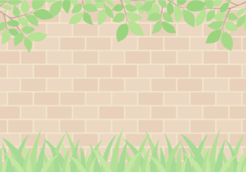 レンガ外壁背景（枝葉と草）