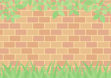レンガ外壁背景（枝葉と草）